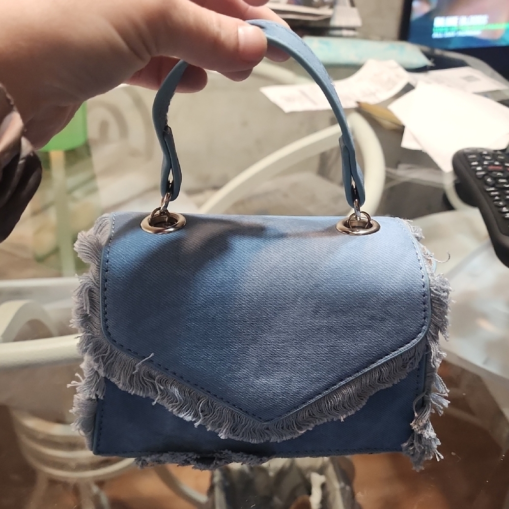 Frayed Denim Mini Crossbody Bag with a V-flap design. Stylish Blue Women's